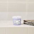 Davines LOVE Smoothing Instant Mask with the LOVE Smoothing range on a bathroom shelf